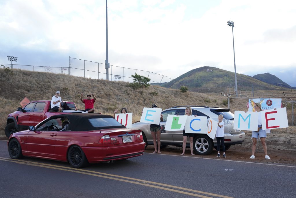 Lahainaluna High School supporters welcome students back to their campus Monday, Oct. 16, 2023, in Lahaina. The school has been closed since the Aug. 8 fire and studying at other schools in Maui. (Kevin Fujii/Civil Beat/2023)