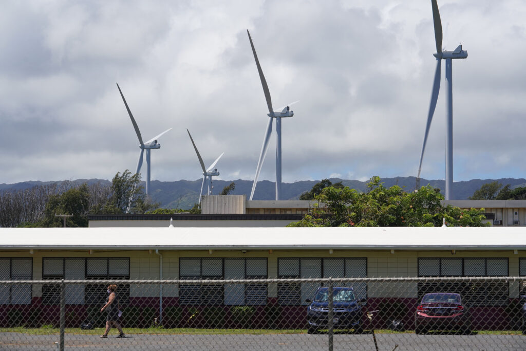 Windmills tower over Kahuku High School.